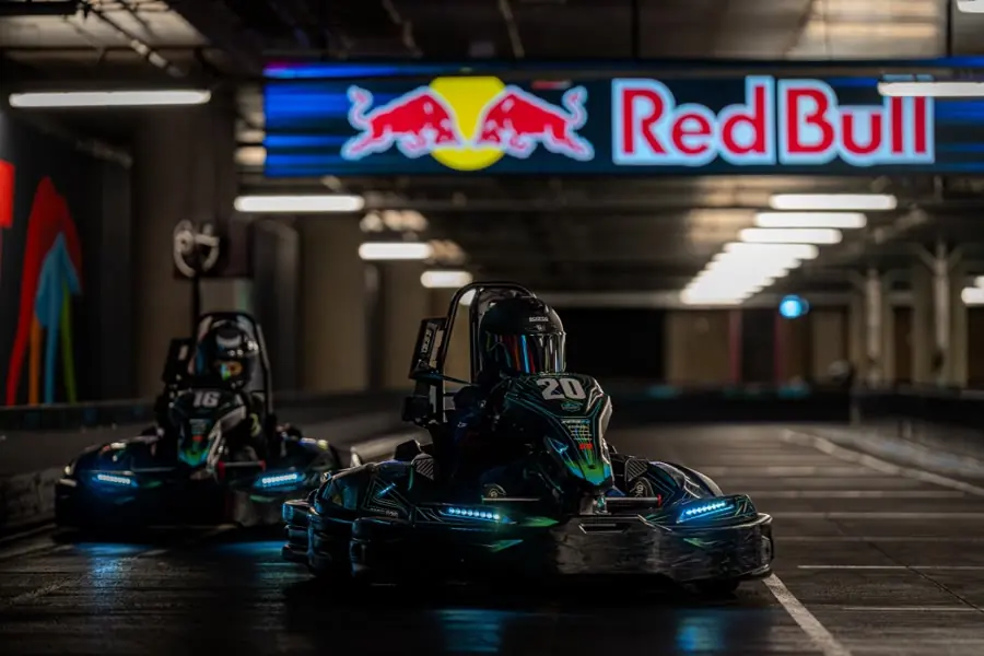 Two karts under the Red Bull gantry